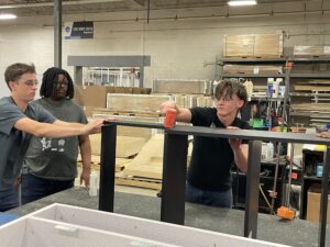 SEED students assembling a bookcase